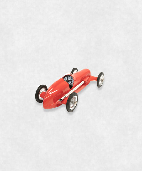 Vintage racing silberfeil car model inspired by classic Grand Prix racers and Silver Arrow legends, featuring a red race car body with a striking black seat. A collectible car model for motorsport and classic car enthusiasts. Viewed from a diagonal perspective of its back