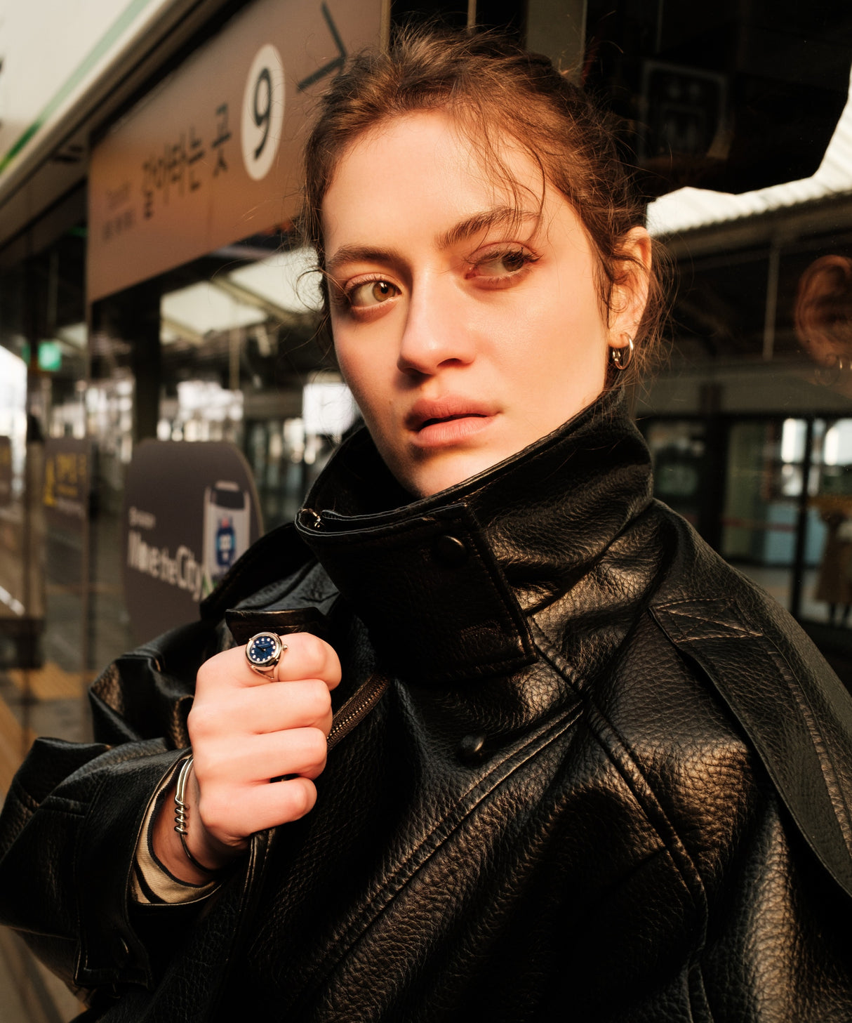 Ring watch by Maison Davis worn on a woman’s finger – elegant miniature watch jewelry