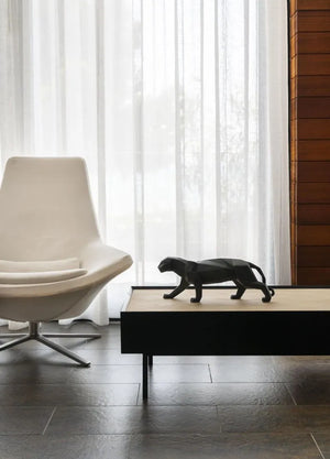 Artistic  black porcelain panther sculpture enhancing luxury living room decor, handcrafted in Spain
