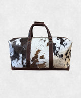 Back view of cowhide leather travel bag highlighting smooth leather finish and sturdy design