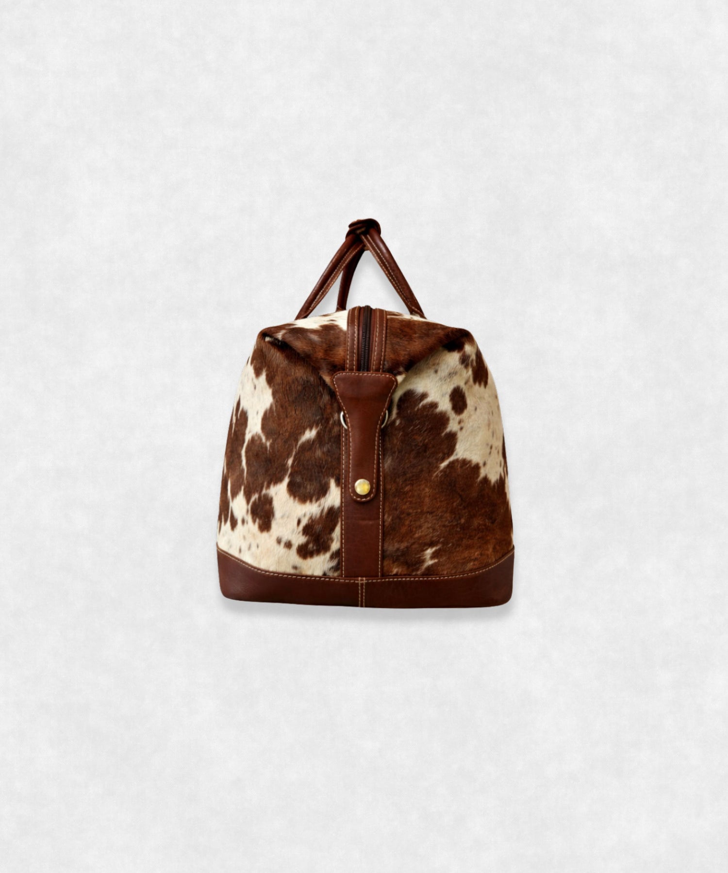 Side view of premium cowhide leather travel bag showing durable stitching and stylish profile