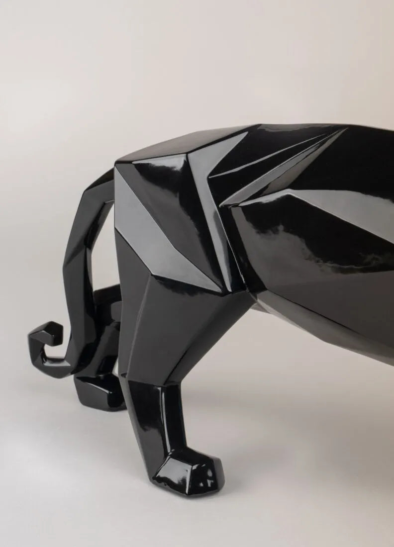 Close-up of shiny black porcelain panther showing reflective glossy surface, made in Spain