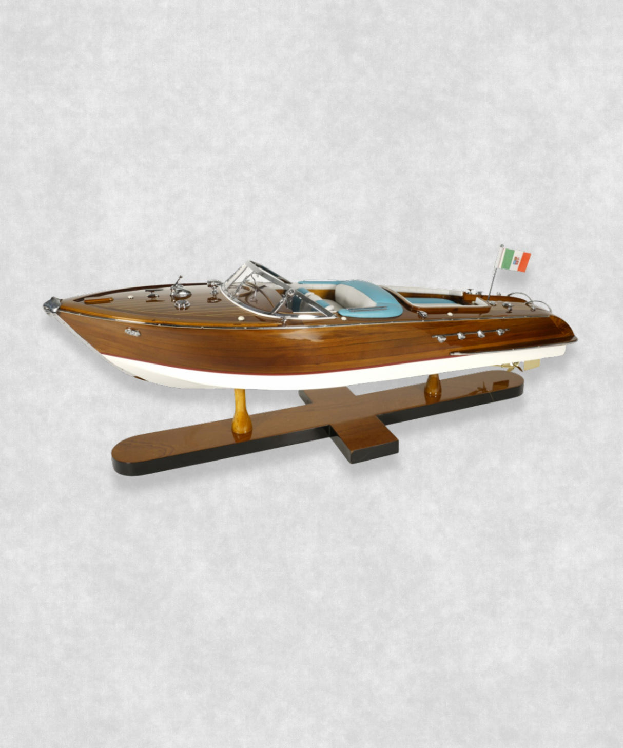 Handcrafted Riva speedboat model featuring polished wood and blue leather seats